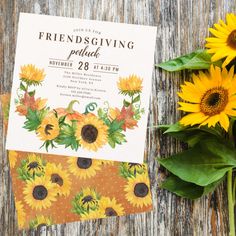 the sunflowers are sitting on top of the table next to the card and flowers