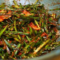 stir fried green beans with sauce in a blue bowl