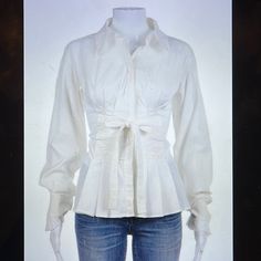 In Excellent Condition Yves Saint Laurent Button Down Pleated Tie Waist Collared Shirt Blouse. Long Sleeve Pleated Button Cuff. Fitted Waist, Cotton, Nylon, Spandex. There Is A Small Spot On The Inside Of Collar ( Pls See Photo ) Can Not Be Seen On The Outside. Size S Bust 16” Waist 14 1/2 “ Length 25” Elegant Fitted Tops With Covered Buttons, Fitted Classic Blouse With Covered Buttons, Designer Fitted Long Sleeve Blouse, Fitted Formal Blouse With Buttons, Formal Fitted Blouse With Buttons, Fitted Blouse With Button Closure And Spread Collar, Fitted Blouse With Covered Buttons For Office, Elegant Fitted Blouse With Covered Buttons, Fitted Tops With Covered Buttons For Office