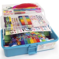 a blue plastic box filled with lots of crafting supplies