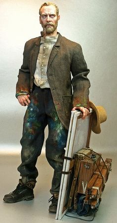 a statue of a man holding a suitcase