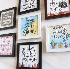 six framed art pieces with different sayings displayed on a white wall in various frames