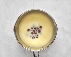 a pan filled with liquid sitting on top of a counter