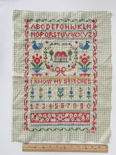 a cross stitch pattern on a piece of cloth