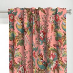 a pink curtain with flowers and birds on it