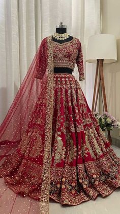 a red lehenga with gold embroidery work