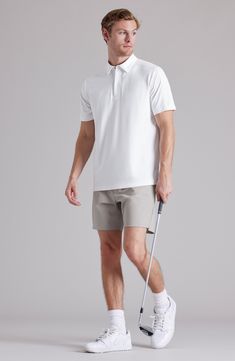 Cut from a lightweight, high-stretch knit, this polo is designed to keep you moving in comfort no matter what the day's activity brings your way. 28 1/2" length (size Medium) Covered quarter zip with snap closure Spread collar Short sleeves 88% nylon, 12% elastane Machine wash, tumble dry Imported Sporty Breathable Polo Shirt For Golf, White Breathable Casual Polo Shirt, Athleisure Moisture-wicking Polo Shirt, Casual White Breathable Polo Shirt, Moisture-wicking Polo Shirt For Athleisure, Casual White Stretch Polo Shirt, Casual Go-dry Polo Shirt For Golf, White Casual Polo Shirt With 4-way Stretch, Fitted Polo Shirt For Golf In Athleisure Style