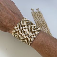 a close up of a person's arm with two bracelets