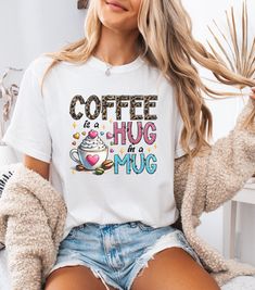 This Cute Comfort Colors T-shirt for Coffee Lovers with the text 'Coffee is a hug in a mug' is a great gift for coffee addicts, adding a little silliness to the day. Perfect for casual wear or as a fun gift for any coffee enthusiast. Ideal for birthdays, holidays, or just because. Product features - Available in multiple sizes from S to 4XL (select partners) for the perfect fit - Double-needle stitching on all seams for durability - Garment-dyed fabric for a soft color and texture - Made with hi Coffee Shirts, Coffee Addict, Graphic Shirts, Tshirt Colors, Comfort Colors, Casual Wear, Perfect Fit, Best Gifts, Relaxed Fit