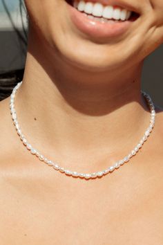 Clad with tiny pearl beads in an alabaster white sheen and luster, this gold-filled necklace is a handmade Hawaiian treasure beaded to elegantly exemplify island life. Wear this gold pearl necklace alone or layered for a classically elegant allure.✦ DETAILS ✦✧ Name: Maile (MIE-leh) - vine.✧ Adjustable Length from: 15"-17" Inches.✧ White 3-4mm Freshwater Pearls.✧ 14kt Gold Filled Components, Extender, and Clasp.✧ All Ke Aloha Jewelry pieces come packaged thoughtfully, beautifully, and ready for g Dainty Single Strand Pearl Necklace In White, Dainty Single Strand Pearl White Necklace, Dainty Pearl White Single Strand Necklace, Delicate Everyday Beaded Necklace With Pearl Drop, Delicate Beaded Necklaces With Pearl Drop For Everyday, Delicate Pearl Drop Beaded Necklaces, Everyday White Single Strand Pearl Necklace, Delicate Pearl Necklace With Tiny Beads For Everyday, Pearl White Necklace With Tiny Beads