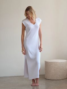 Our Supima Cotton Maxi Beach Dress is soft, comfortable, and durable, making it perfect for everyday wear. This dress’s indulgent use of luxury rib fabric means it floats on your body rather than hugging tight, making it ideal for a spring picnic or a breezy day at the beach. The Maxi Beach Dress can also be styled, with boots and a jacket, for a casual get-together with friends. The ribbed texture adds dimension with flexibility to the classic Maxi silhouette. Fitted V-neck Maxi Dress For Loungewear, Chic Longline Maxi Dress For Loungewear, Sleek V-neck Maxi Dress For Spring, Solid Stretch Midi Dress For Loungewear, Summer Modal Dress, Spring Maxi Dress For Lounging, Spring Ribbed Maxi Dress For Loungewear, Spring Dresses In Modal With Stretch, Spring Stretch Modal Dresses