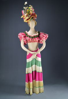 a mannequin wearing a colorful dress with flowers on it's head and neck