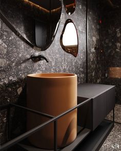 a bathroom with marble walls and flooring, two round mirrors hanging from the ceiling