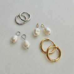 These freshwater pearl hoop charms come in a great addition to your hoop charm collection.   PRODUCT DETAILS:  - Natural freshwater pearls - 8mm x 9mm - Sold as a pair (charms only) - Choose gold or silver loop (stainless steel) Perfect to pair with these hoops: https://www.etsy.com/listing/1688754322/hoop-earrings-for-charms-5-sizes?click_key=b69efa522ba8189da30669ca50f5d99d0d061c15%3A1688754322&click_sum=85eaf496&ref=shop_home_active_2&pro=1&frs=1&sts=1 Care Instructions: We highly recommend t Classic Huggie Jewelry With Pearl Charm, Classic Dangle Hoop Earrings With Pearl Charm, Teardrop Huggie Earrings With Pearl Charm, Everyday Hoop Jewelry With Pearl Charm, Everyday Silver Hoop Earrings With Pearl Charm, Silver Huggie Earrings With Pearl Drop, Everyday Round Hypoallergenic Pearl Earrings, Everyday Hypoallergenic Round Pearl Earrings, Everyday Pearl Charm Dangle Huggie Earrings