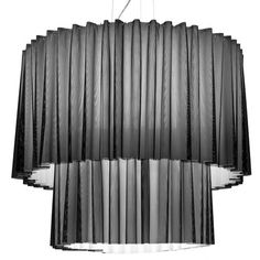 a black and white photo of a chandelier with pleated fabric on it