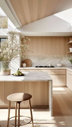 a kitchen with wooden cabinets and white counter tops, along with an island in the middle