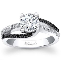 an engagement ring with black and white diamonds