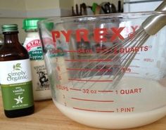 the ingredients to make an egg mixture are in a mixing bowl with a whisk