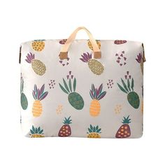 a white bag with pineapples on it