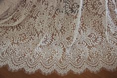 the lace is white and has brown spots on it