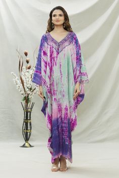 Lavender, blue tie dye kaftan with floral embroidery on the neckline.
Components:1
Pattern:Tie Dye and Embroidery
Type of Work:Thread and Beads
Neckline:V neck
Sleeve Length:Kaftan Sleeves
Fabric:Habutai Silk
Color:Purple,Blue
Other Details:
Sequin and bead tassel detail
Occasion:Resort - Aza Fashions Spring Bohemian Kaftan With Batik Print, Spring Bohemian Batik Print Kaftan, Multicolor V-neck Kaftan With Batik Print, Spring V-neck Kaftan With Batik Print, Spring Batik Print Maxi Length Kaftan, Spring Batik Print Maxi-length Kaftan, Bohemian Tie Dye V-neck Kaftan, Bohemian Tie-dye V-neck Kaftan, Long Batik Print Kaftan For Spring