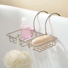 a bathtub with soap, shampoo and sponges hanging from it's sides