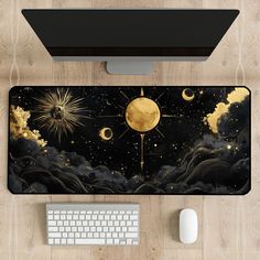 a computer desk with a mouse and keyboard on it, along with an image of the moon in the sky