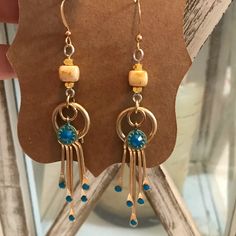 Hand-Crafted Bohemian Gold Earrings With Turquoise Swarovski Crystals Bohemian Blue Earrings With Dangling Beads, Blue Bohemian Earrings With Dangling Beads, Blue Bohemian Dangle Earrings, Bohemian Blue Nickel-free Earrings, Bohemian Czech Glass Pierced Earrings, Bohemian Pierced Earrings With Czech Glass, Blue Metal Earrings With Dangling Beads, Pierced Czech Glass Dangle Earrings, Pierced Czech Glass Drop Earrings