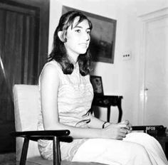 black and white photograph of a woman sitting in a chair