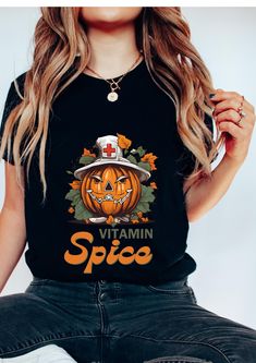 𝕯𝖊𝖘𝖈𝖗𝖎𝖕𝖙𝖎𝖔𝖓 This Pumpkin Spice Nurse T-shirt is the perfect blend of autumn vibes and Halloween fun! Featuring a pumpkin dressed as a nurse, this clever design showcases the playful phrase Pumpkin Spice, making it an ideal choice for the fall season. Whether you're a fan of pumpkin spice or a dedicated healthcare worker, this shirt is perfect for adding a bit of Halloween nurse humor to your wardrobe. Great for fall t-shirts, medical Halloween shirts, or for any spooky nurse looking to celebrate the season. With its high-quality, soft fabric, this shirt is perfect for Halloween parties, trick-or-treating, or as a thoughtful nurse gift for the holiday season.  𝕯𝖊𝖙𝖆𝖎𝖑𝖘 🍀 Please refer to size chart before ordering. If possible, measure your favorite t-shirt armpit to armpit Thanksgiving Shirts Nurse, Nurse Pumpkin, Nurse T Shirts, Halloween Humor, Pumpkin Dress, Funny Nurse, T Shirts Funny, Halloween Nurse, Halloween Shirts