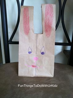 a paper bag with a bunny face drawn on it