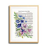 a cross stitch pattern with blue and purple flowers on it, framed in a wooden frame