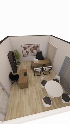 an aerial view of a living room and dining area in a small apartment with wood flooring