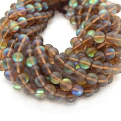 multicolored glass beads on white background