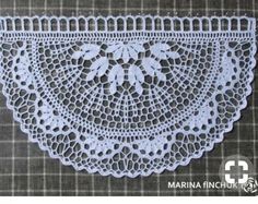 a white doily with flowers on it