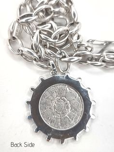 French Coin in beautiful setting! The bezel on this setting has tiny rhinestones around the inside and outside of the circle. This 50 mm pendant is a replica of an 1890's coin and is beautiful on both the front and the back. (1 3/8"). The chain has a soft burnished silver finish. Choose from 3 lengths. An interesting and easy to manage gate clasp that will hook on any link in the chain. Same necklace on Pearls Chunky Cable Bracelet shown in last photo Shop with confidence! We want you to love we French Coins, Cable Bracelets, Coin Pendant Necklace, Photo Shop, Double Chain, The Circle, Rolo Chain, Coin Pendant, Silver Coins