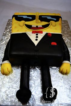 a cake that looks like spongebob with sunglasses on it's head and legs