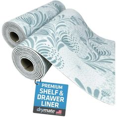 a roll of white and blue wallpaper next to a sign that says, premium shelf & drawer liner