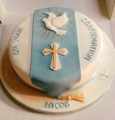 a cake decorated with a cross and dove