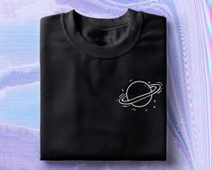 Saturn Space T-Shirt (Unisex)   📡 The Internet Club 📡 +Printed on 100% Soft Cotton  +First Class Delivery UK  +UK based +Message for bundle discounts and customs.  Find sizing guide in the listing photos. Available in S  M  L XL Cheap Space-themed Short Sleeve T-shirt, Planet Shirt, Space Tee, Space Outfit, Space Shirts, Space Planets, Polo T Shirts, Sorority Shirts, Unique Shirt