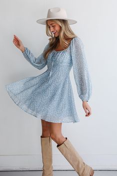 You'll draw in new admirers left and right when you step out in the Passionate Aura Dusty Blue Floral Mini Dress! This women’s mini dress is adorned with a delicate floral pattern in a soft light blue hue, evoking a sense of serene beauty and youthful grace. Crafted from a lightweight, airy fabric, this dress ensures comfort and fluidity with every movement. The fitted bodice features a sweetheart neckline, complemented by voluminous balloon sleeves that add a touch of romance and whimsy. The dr Light Blue Floral Mini Dress For Day Out, Light Blue Floral Mini Dress, Flowy Light Blue Mini Dress With Floral Print, Light Blue Floral Print Mini Dress With Puff Sleeves, Light Blue Floral Print Short Sleeve Mini Dress, Blue Floral Mini Dress, Light Blue Mini Dress, Mini Dress Floral, Hoco Dress