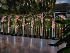 an elaborately decorated wall with candles and flowers