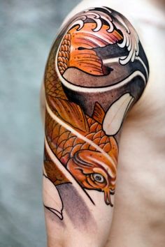 a man with a tattoo on his arm has a fox and fish design on it