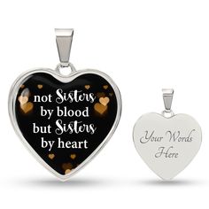 two heart shaped pendants with the words, not sisters by blood but sisters by heart