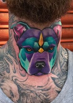 a man with a tattoo on his neck has a bear face painted on the side