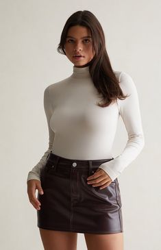 Experience elevated comfort and style with the Luxe High Neck Long Sleeve Top from Contour. This sophisticated piece boasts a high neckline, providing a touch of modern elegance, while the comfortable stretchy fabric ensures a seamless blend of fashion and comfort.


	Solid color top
	Long sleeves
	Mock neckline
	Regular fit
	Fitted
	94% polyamide, 6% elastane jersey
	Model is wearing a size xsmall High Neck Long Sleeve Top, High Neck Long Sleeve, Mock Neckline, Modern Elegance, Fall Winter Outfits, High Neckline, Stretchy Fabric, Pacsun, Long Sleeve Top