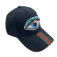 Experience a captivating style with our Evil Eye Striped Rhinestone Cap. Stunningly embroidered with sequins and lash accents, this black baseball hat is perfect for any occasion. Plus, it's adjustable for a perfect fit. Upgrade your look now! Polyester Product color and quality vary slightly compared to actual items due to photography lighting conditions and individual screen color calibration. Please contact us for questions regarding additional item details. Trendy Rhinestone Snapback Baseball Cap, Trendy Snapback Baseball Cap With Rhinestones, Trendy Black Baseball Cap With Embroidery, Trendy Black Embroidered Baseball Cap, Rhinestone Baseball Cap One Size, Rhinestone Embellished One Size Baseball Cap, Black Adjustable Embellished Hats, Scarf Coverup, Black Baseball Hat