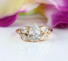 a ring with three pear shaped diamonds on it