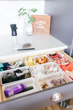 an organized drawer is shown with various items in it