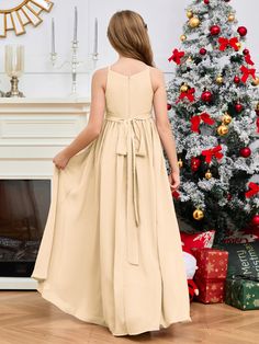 Keep your little bridesmaids cute and timeless with this Halter Floor-Length Chiffon Junior Bridesmaid Dress. Crafted with soft, lightweight chiffon and a halter neckline, this dress is perfect for any special day. The floor-length design provides elegant sophistication and ensures your bridesmaids are comfortable throughout the day. Bridesmaid Dress Gold, Bridesmaid Dress Champagne, Dress Peach, Dress Champagne, Junior Bridesmaid Dress, Dress Gold, Junior Bridesmaid Dresses, Junior Bridesmaid, Halter Neckline